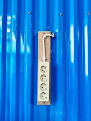 electric socket, and blue background