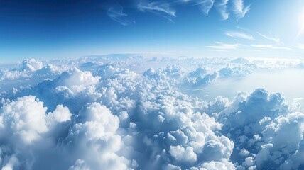 Fototapeta premium Vast sky filled with cottonlike clouds and a gradient of blue hues, sky panorama, spaciousness