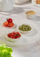 Vegetable sauces of different colors in bowls on a light background