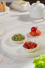 Vegetable sauces of different colors in bowls on a light background