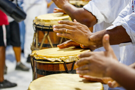 people playing tambourine outdoors in Rio de Janeiro.