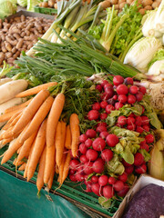 Fresh organic vegetables lying on green market stall
