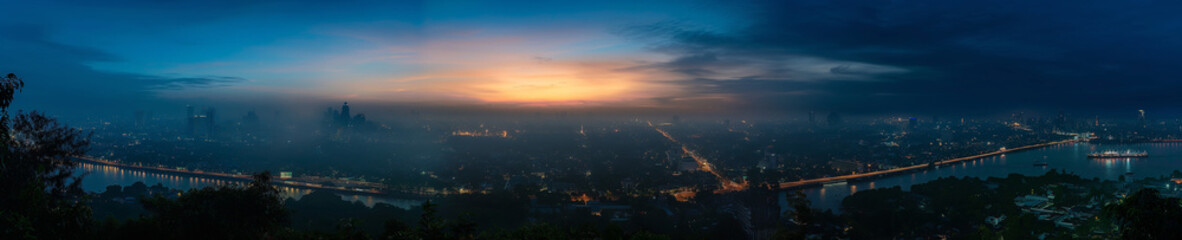 Obraz premium Serene Morning Panorama of Bangkok Skyline Reflecting in the Chao Phraya River