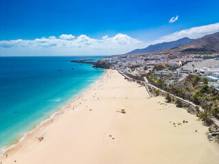 White sandy beach and blue water in Morro Jable, south of Fuerteventura, Canary islands