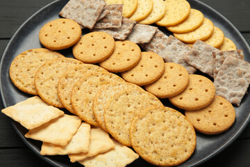 Different crackers on dark background. Macro photo
