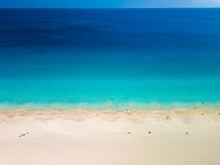White sandy beach and blue water in Morro Jable, south of Fuerteventura, Canary islands
