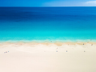 White sandy beach and blue water in Morro Jable, south of Fuerteventura, Canary islands