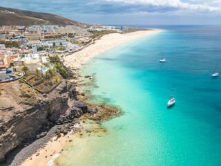 White sandy beach and blue water in Morro Jable, south of Fuerteventura, Canary islands