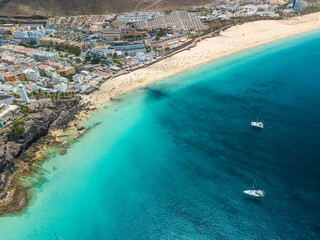 White sandy beach and blue water in Morro Jable, south of Fuerteventura, Canary islands