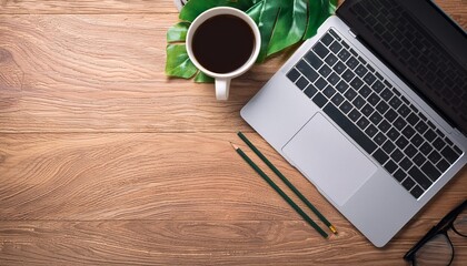 Flat lay top view office table desk Workspace with laptopoffice supplies pencil green leaf and coffee cup on wood background