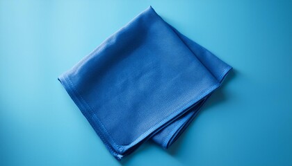 top view with blue kitchen napkin isolated on table background Folded cloth for mockup with copy space Flat lay Minimal style
