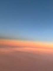 The sky transitions from a deep blue at the top to a soft pink near the horizon, creating a gradient of colors that evoke a sense of calm and serenity during sunset