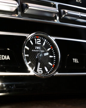 Mercedes Benz analog clock on dashboard, Luxury car interior detail, IWC watch