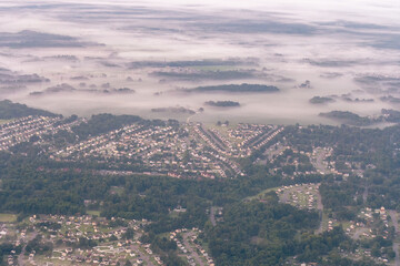 Richmond, Virginia - Aerial view of suburban developments and residential homes in Richmond, Virginia on a foggy morning