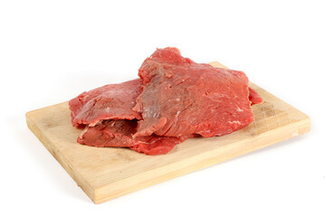 steak raw on wooden cutting board isolated on white 