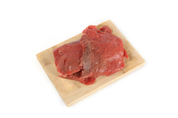steak raw on wooden cutting board isolated on white 