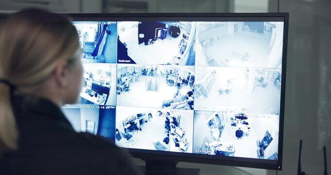 Woman, check and screen for cctv monitor for protection, security service or building safety. Back view, video surveillance agency or female person in control room with footage or camera at night