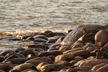 Rocky Shoreline at Sunset with Waves