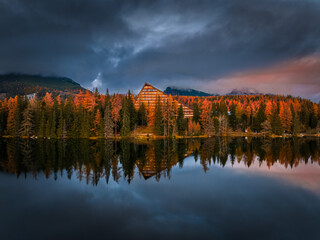 Strbske Lake, Slovakia - Panoramic view of reflecting iconic Strbske Lake (Strbske Pleso) on a sunny autumn afternoon with High Tatras and Tatras Tower at background