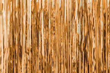 Gold yellow foil strip background. Curtain hanging on wall. Festive, Christmas, New Year or anniversary party concept. Decorative wallpaper