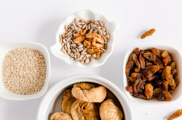 Vegan dessert made from nuts, seeds,dry fruits. Sugar free. Healthy sweets. White background, top view