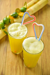 Nuoc mia is Vietnamese sugarcane juice with the real fruit background. A typical organic summer drink. The fruit is freshly squeezed, its sweet flavor helps to ease stress, regulates body temperature