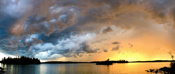 Sunset over a lake after a storm. 