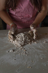 female hands molding dough for traditional cooking