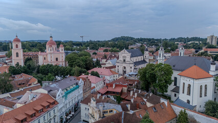 Aerial View of Historic Vilnius With Red-Tiled Roofs and Stone Churches in Late Afternoon Light