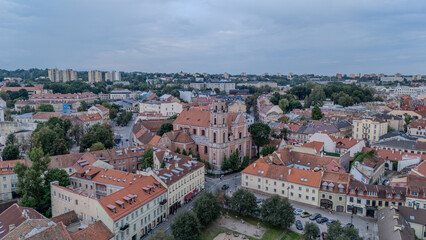 Obraz premium Aerial View of Vilnius City Featuring Historic Architecture and Vibrant Rooftops at Sunset