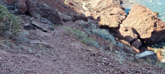 red cliffs on the red beach santorini greece