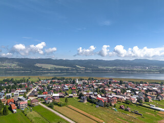 Summer skyline cityscape of Frydman village at Czorsztyn lake (Jezioro Czorsztyńskie) in Lesser Poland (Małopolska), Poland. Wide panoramic aerial view © uslatar