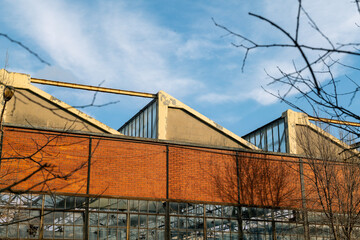 Fototapeta premium abandoned factory, old building, dilapidated industrial areas, left to their fate, the decline of a company leads to unemployment and impoverishment of an urban area. 