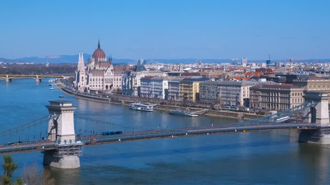 Panorama view of secheni bridge. A morning panorama view of old Secheni bridge against Budapest buildings in Hungary.