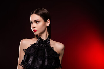 Fototapeta premium Photo of lady wear black evening gown look profile side isolated vivid color background