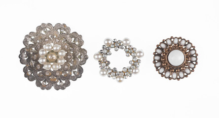 jewelry brooches with pearls isolated on white background