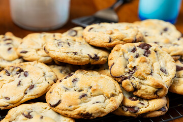 Close up of fresh batch of homemade chocolate chip cookies, selective focus.