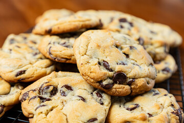 Close up of fresh batch of homemade chocolate chip cookies, selective focus.