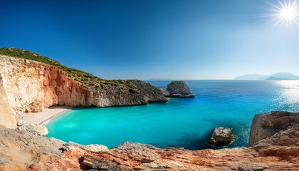 A secluded beach cove with crystal clear water and a bright sun shining