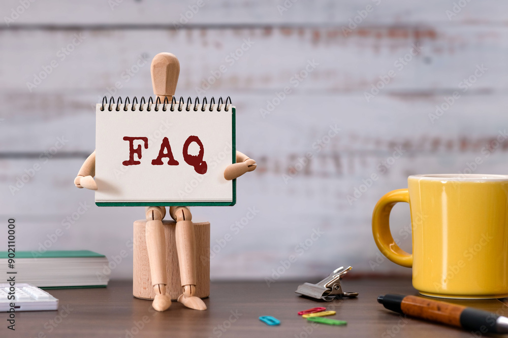 Poster there is notebook with the word faq. it is an abbreviation for frequently asked questions as eye-cat