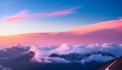 a pink and blue sky with clouds and mountains in the background