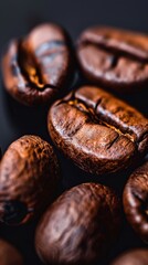 Macro shot of coffee beans on black background, close-up view. Gourmet coffee and lifestyle concept