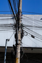 messy electrici wires on the pole, The chaos of cables and wires on an electric pole in Sao Paulo...