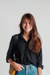 smiling Indonesian 22 years old student girl. looking to the camera in a white background