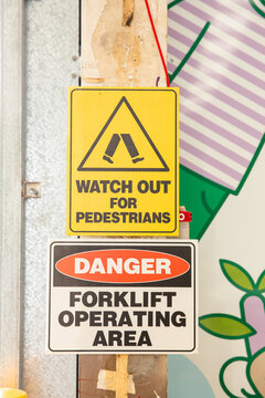 warning signs in an industrial warehouse