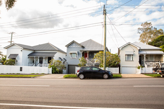 row of cottages on a Brisbane street on a sunny day