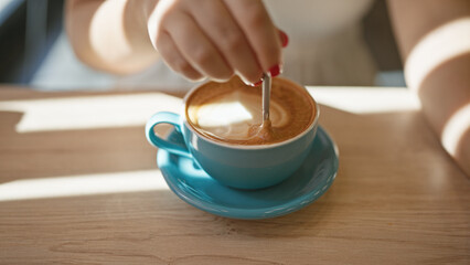 Cafe bliss, young woman enjoys leisurely coffee break, reveling in the sunny interior of a...