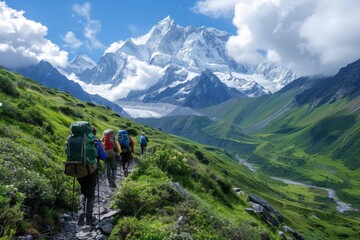 Fototapeta premium Hikers Trekking Through Alpine Valley with Majestic Snow-Capped Mountains in the Background