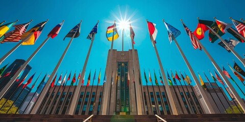 Obraz premium United Nations Building with Flags Flying in Front of Clear Blue Sky