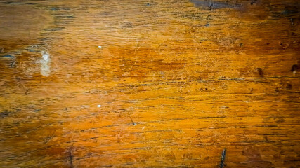 Obraz premium Close-up of wood surface texture with very clear wood grain and brown tones and darker streaks indicating natural pattern. 